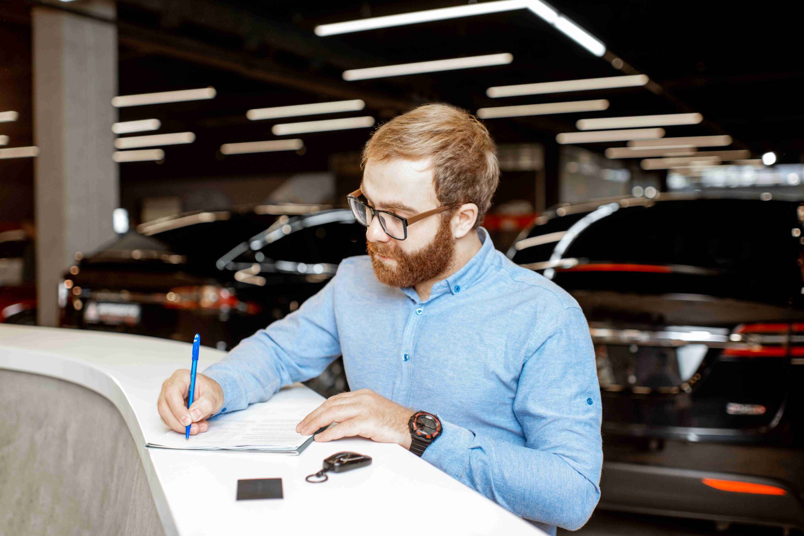 Man buying a new car at global carz dealership